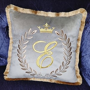 decorative, handmade, embroidered cushion with initials