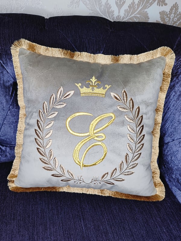 decorative, handmade, embroidered cushion with initials